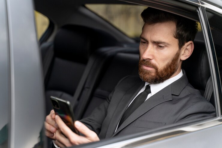 handsome-man-sitting-back-cab_23-2149204596